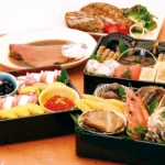 アイスター商事の定番おせち料理「なごやかセット白鳥2027」の「21品目」盛付けイメージ。